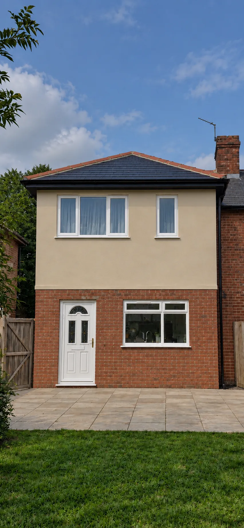 Finished rear extension with a rendered upper floor, brick ground floor and hipped roof