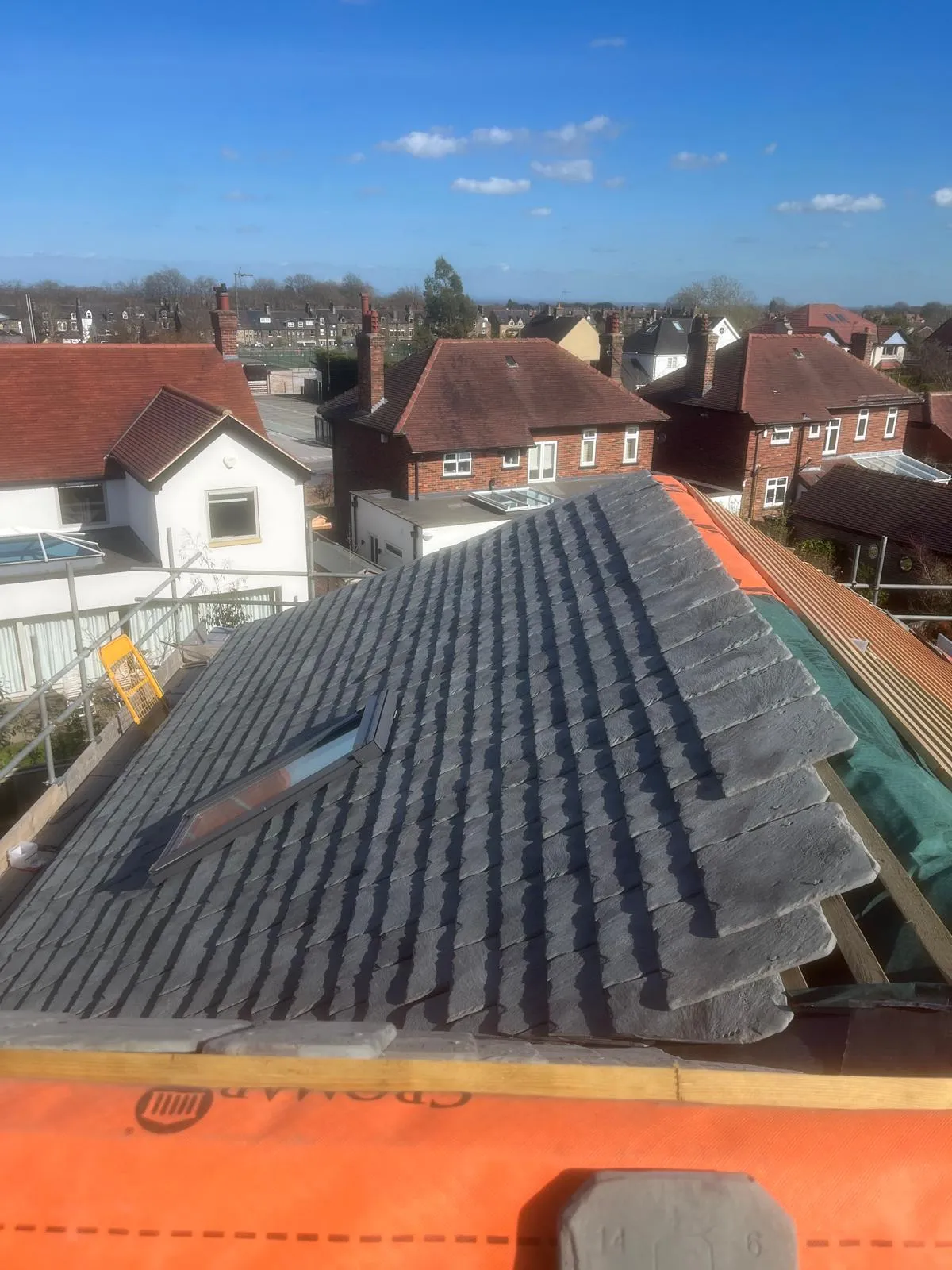 New slates laid to the hip with a rooflight fitted