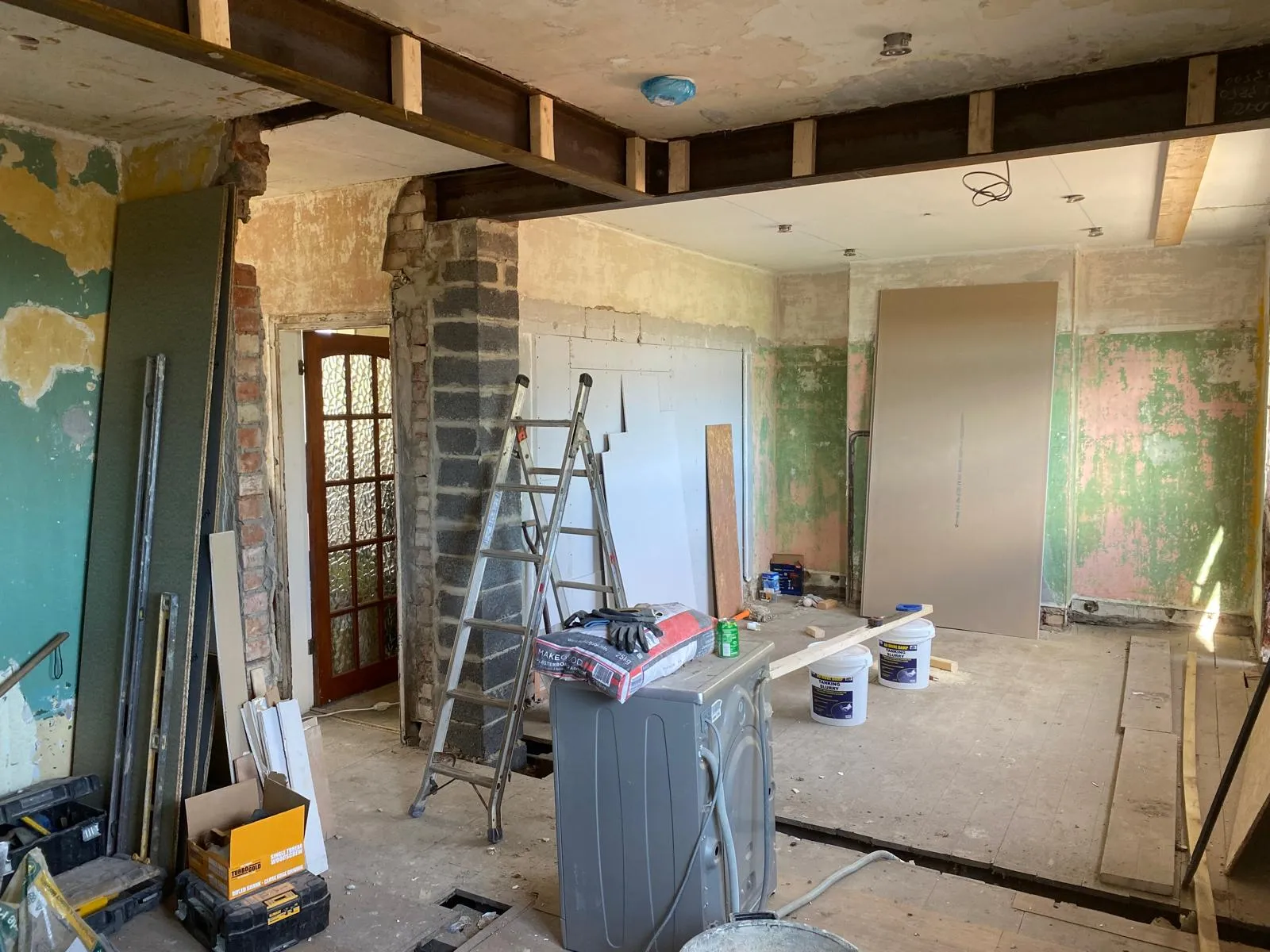 New steel beam spanning the opening where a wall was removed